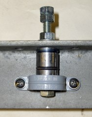 Expanding plug on crossbeam