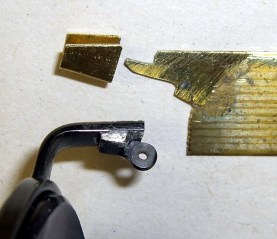 Broken hinge and brass shim stock repair parts