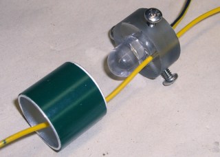 LED in base with spring positioning ring