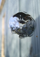 Pellet gun hole in plate glass