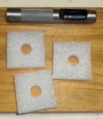 Bottom pads with hole punch