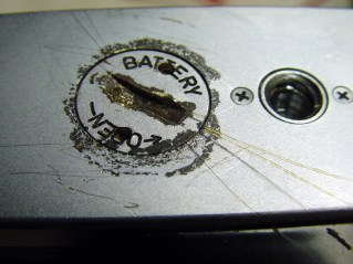 dsc02283 - Scarred camera base Corroded battery lid with scarred camera base