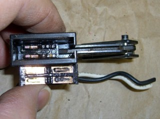 Congealed grease on switch contacts