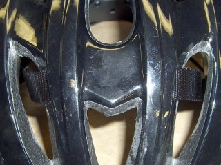 Front strap passing through helmet