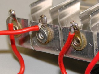 Cell holder rivet - outside