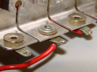 Cell holder rivet - inside