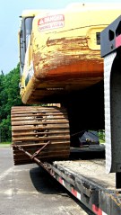 Crane treads overhanging flatbed