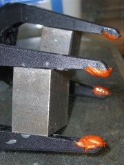 Clamps with copper-silicone gasket pads