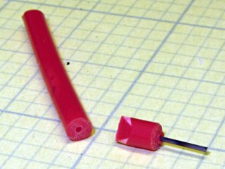 Music wire in filament plug