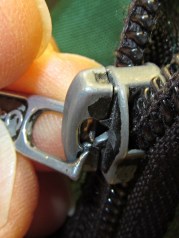 Worn-through zipper tab