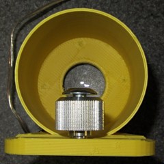 Knob and screw stored in macro adapter