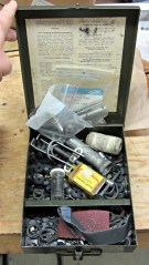 Box of faucet washers and tools