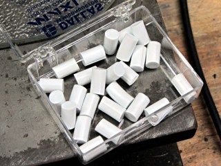 Lid gaskets as pin caps