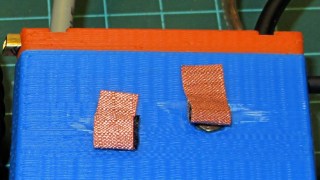 Copper mesh on GPS case contacts