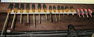 Screwdriver rack on floor joist