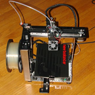 Makergear M2 3D Printer with cardboard protecting glass platform
