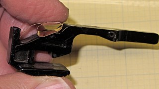 Stapler latch - metal spring fitting