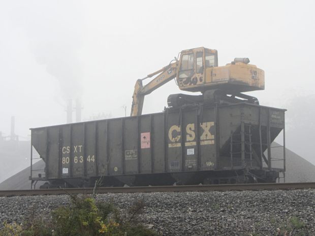 Excavator on CSX gondola car - side