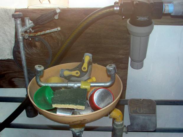Cluttered emergency eye wash station