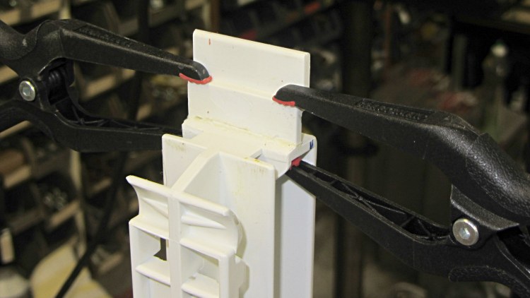 Refrigerator strut - tab clamps