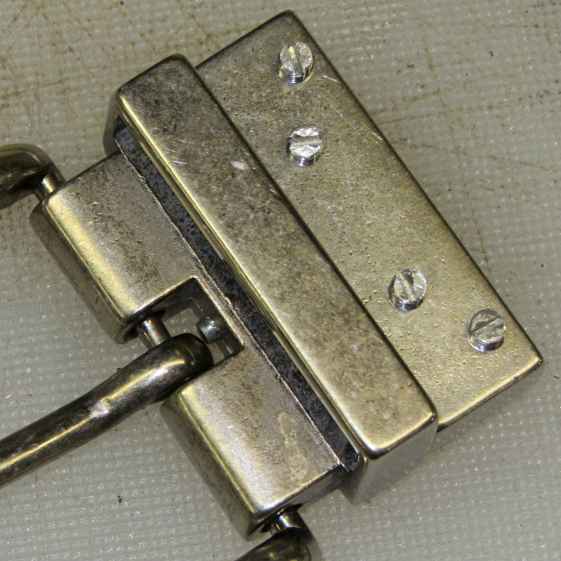 Reversible belt buckle - staked post