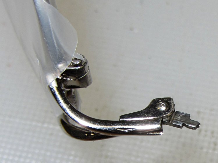 Broken eyeglass temple spring