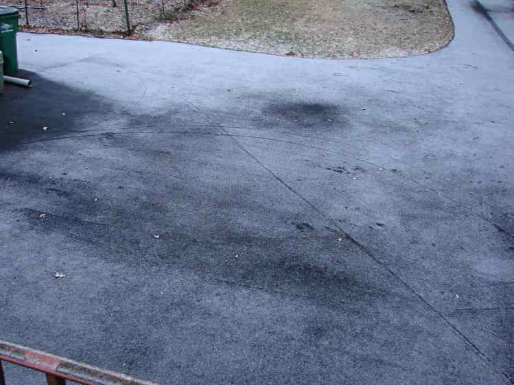 Bike Tracks on Snowy Driveway - overview