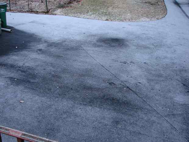 Bike Tracks on Snowy Driveway - overview