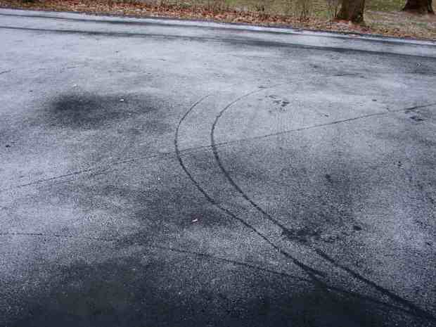 Bike Tracks on Snowy Driveway - detail