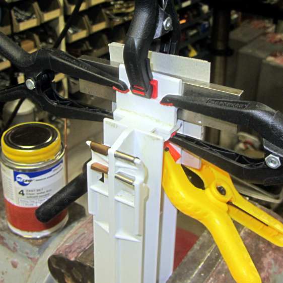 Whirlpool refrigerator drawer strut - clamped