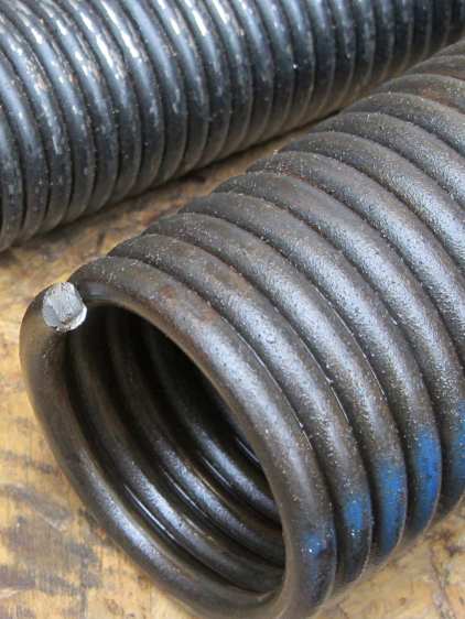 Garage door torsion spring - broken end