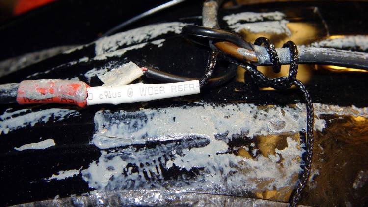 Bell Helmet - mic-earbud wire - hardened tape adhesive