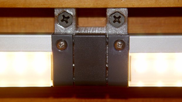 Under-cabinet light bracket - center joiner