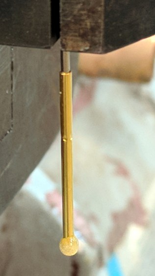 Pogo pin with epoxy switch-pusher drop
