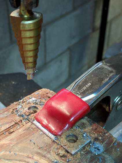Snowblower muffler - drilling bracket