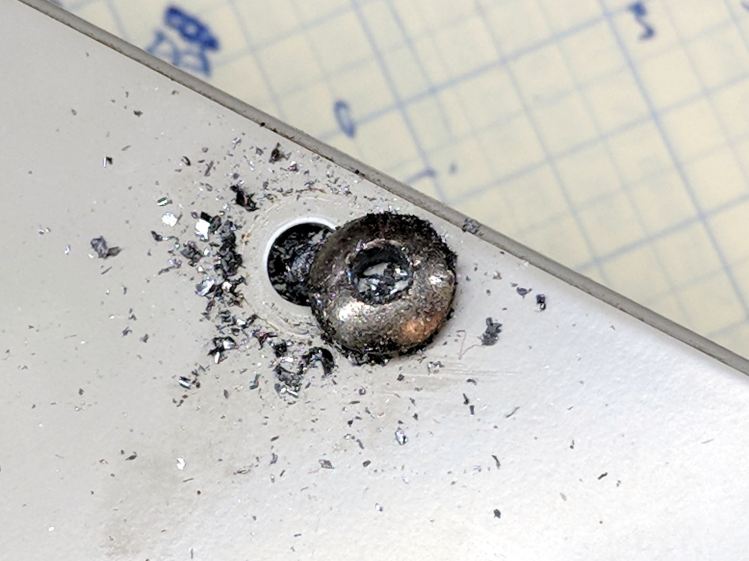 Drilled-out button screw head