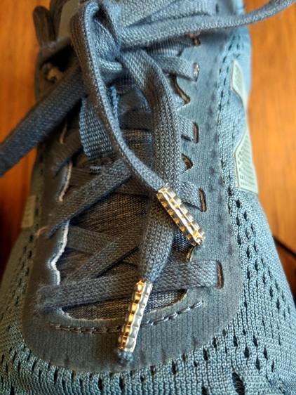 Shoelaces with crimped ferrules