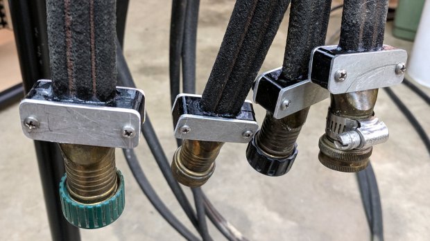 Soaker hose connector leak clamps