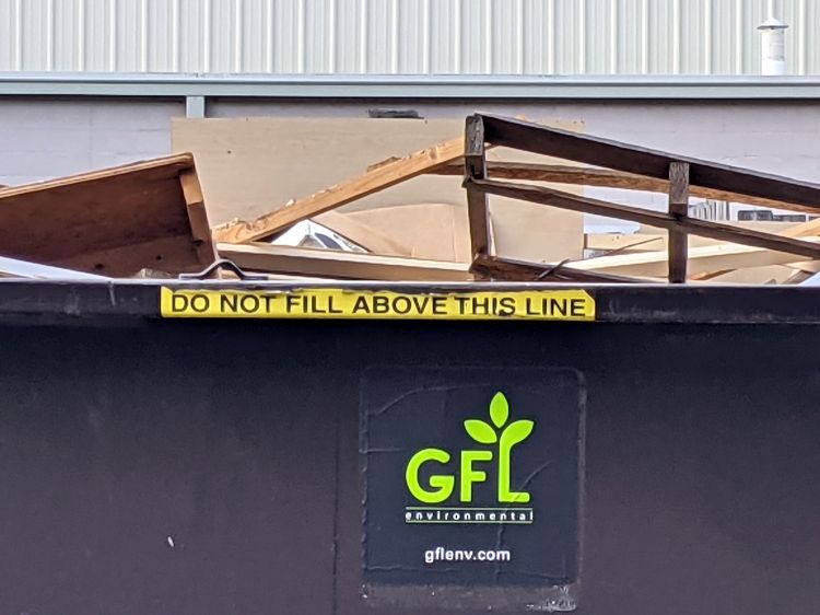 Overloaded dumpster - detail