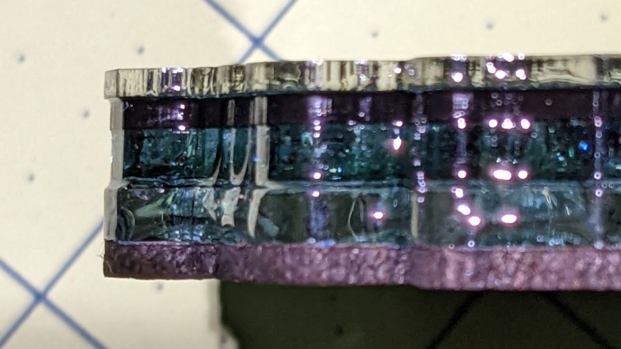 Smashed glass coaster - edge view