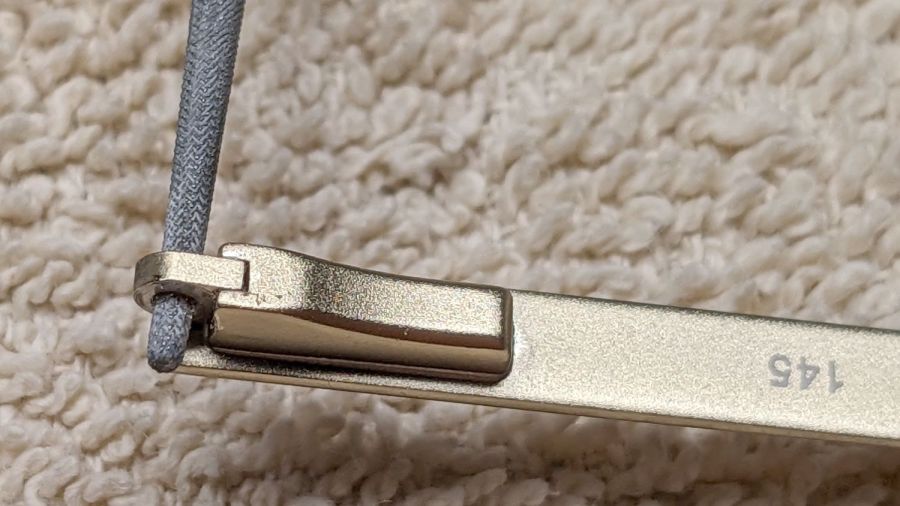 Eyeglass spring temple - hole filing