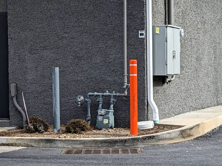 Dunkin drive-through corner bollard - repaired