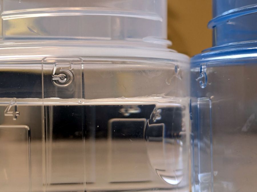 Tide HE shrinkflation - cap capacity marks