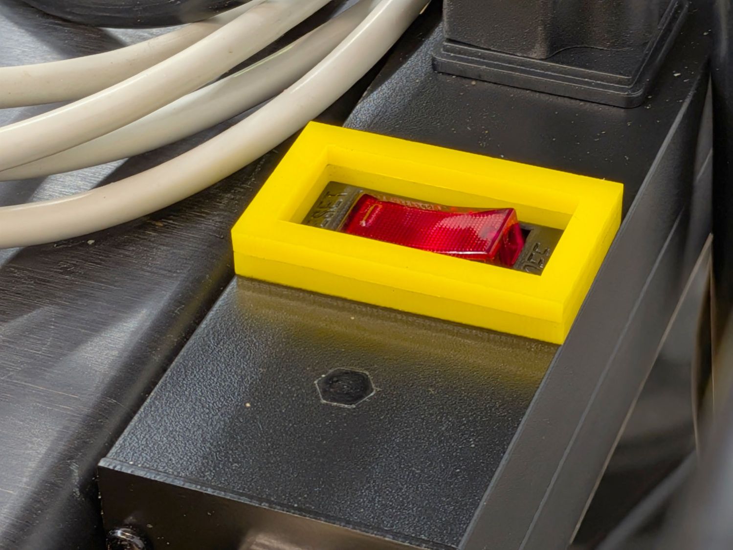 Mollyguard - outlet strip switch